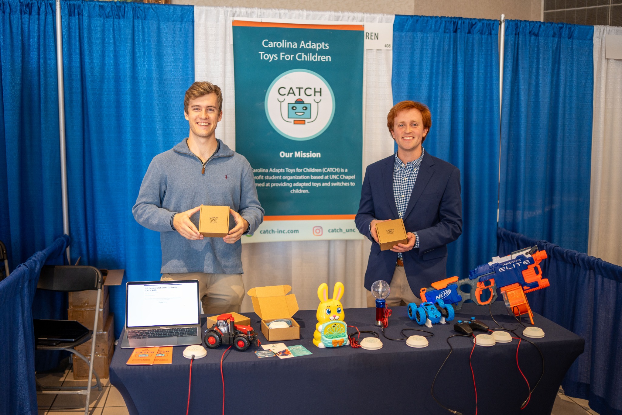 Two people displaying the Button Box